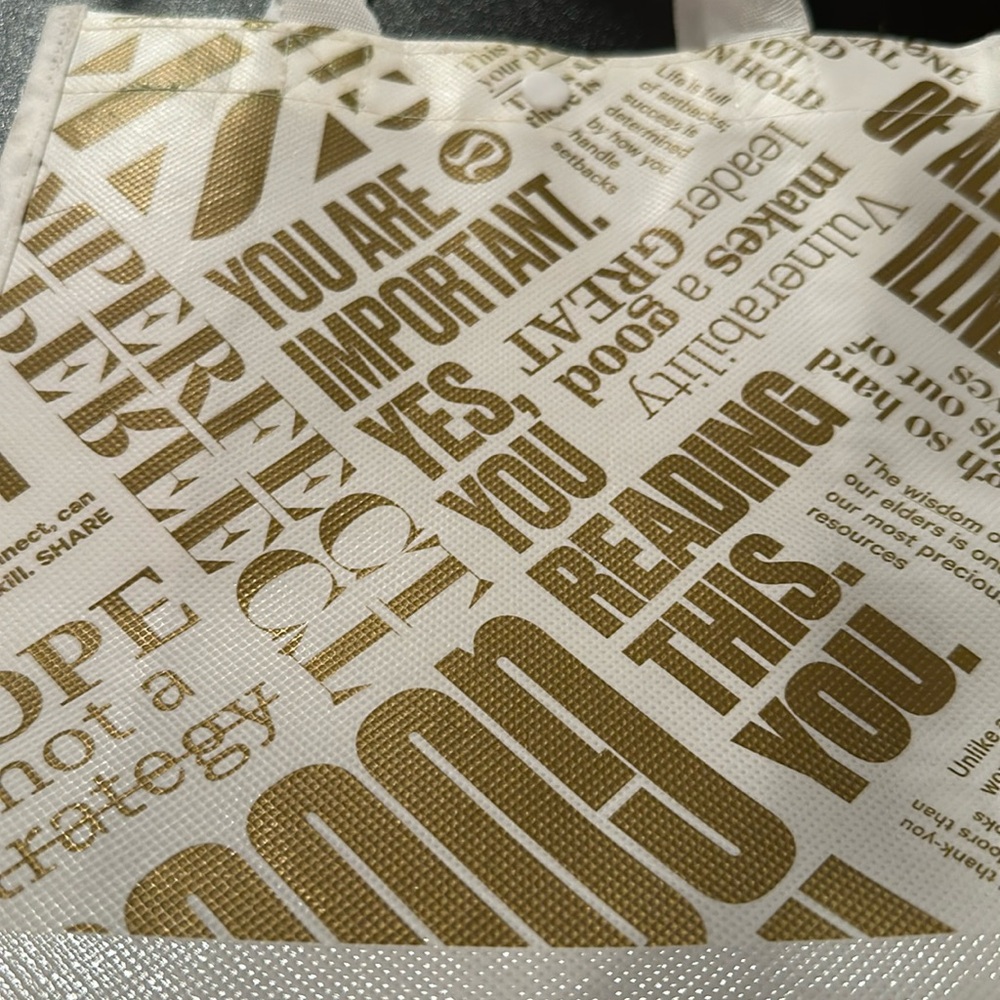 lululemon Gold & White Mini Shopping Bag. Was not reused. Excellent condition.